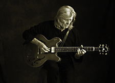 Henry McCullough playing guitar in the studio, 2008